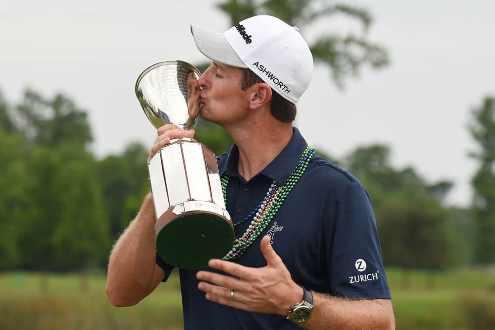 Justin Rose of England poses with the trophy after winning the Zurich Classic of New Orleans